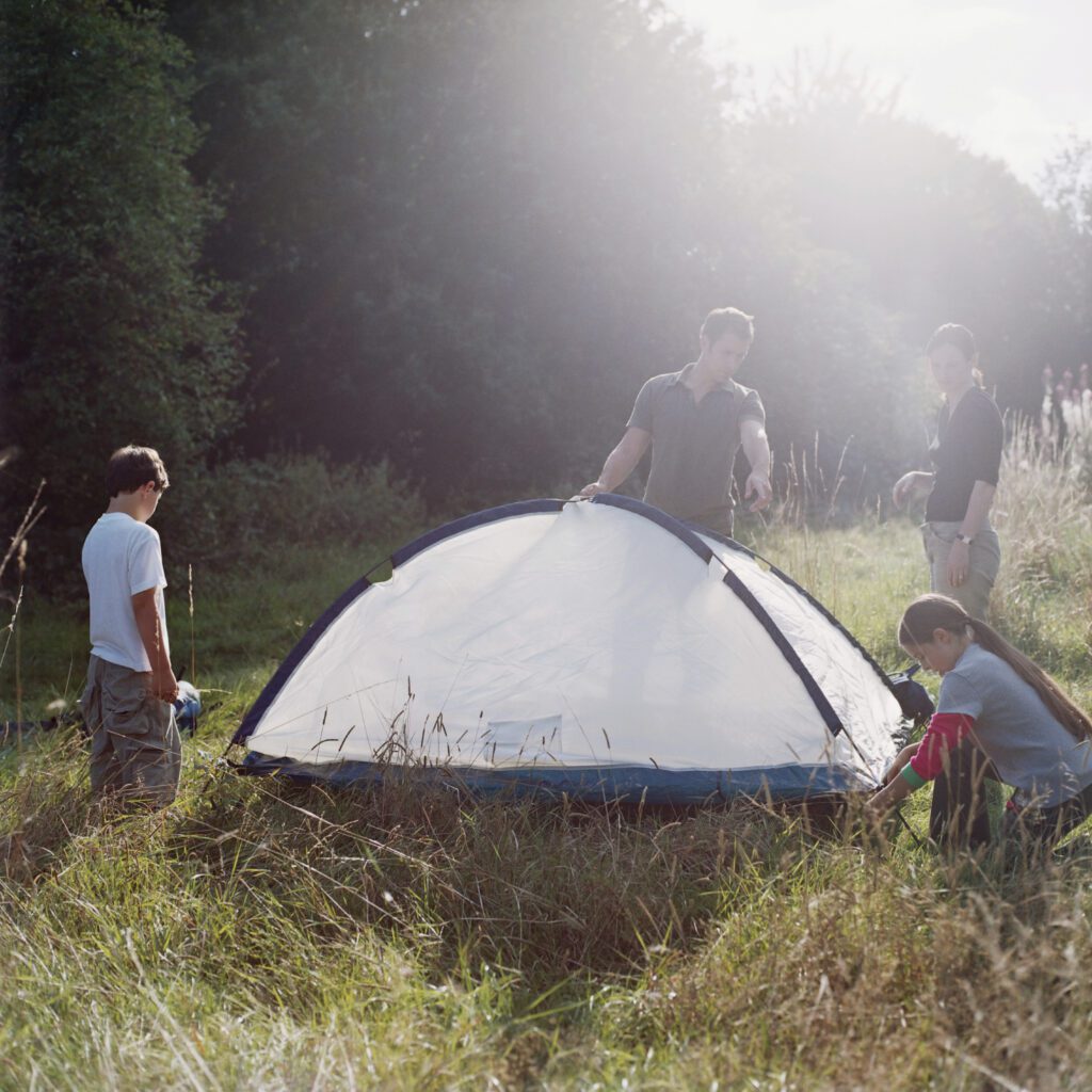 Family erecting a tent